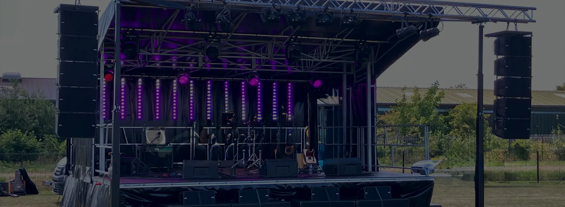 Trailer stage set up and ready to use, with lighting rig and speakers